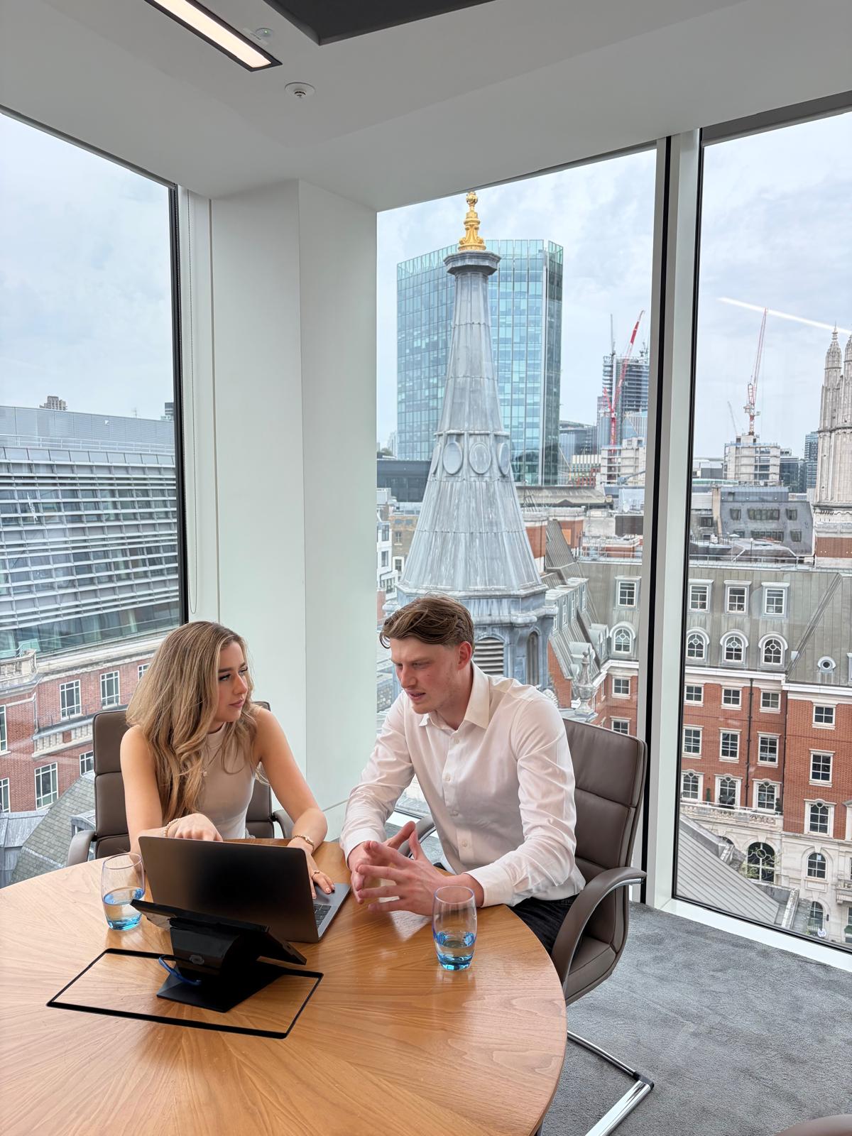 Tabby Cook and Shaun Caulfield working together in a London office